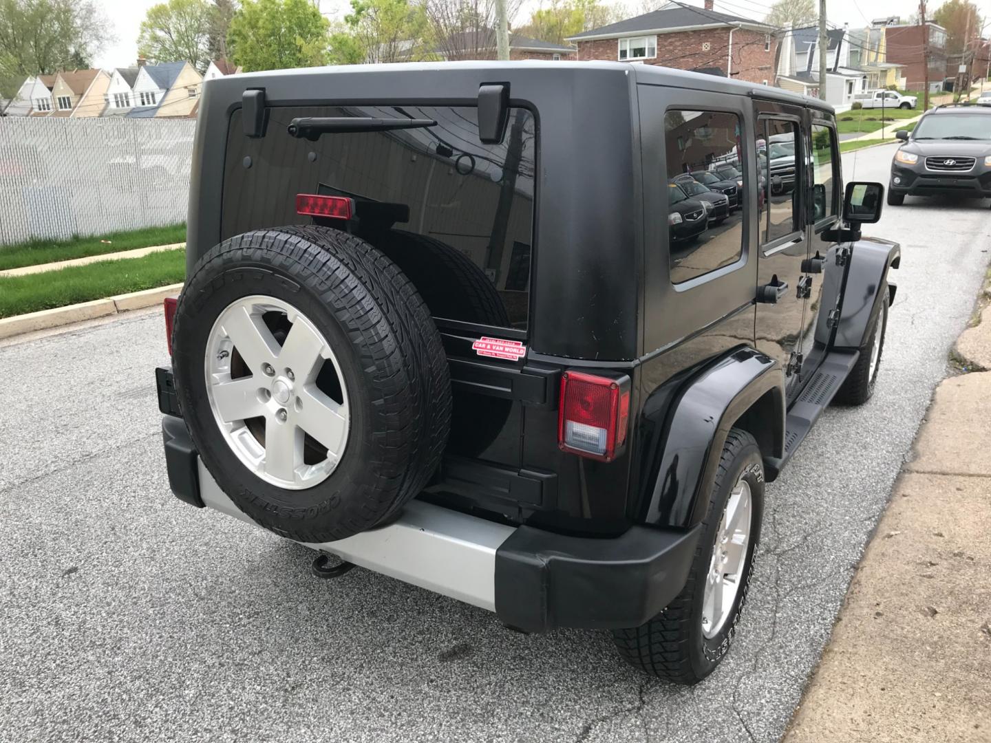 2008 Black /Black Jeep Wrangler Unlimited Sahara 4WD (1J8GA59198L) with an 3.8L V6 OHV 12V engine, Automatic transmission, located at 577 Chester Pike, Prospect Park, PA, 19076, (610) 237-1015, 39.886154, -75.302338 - Photo#5